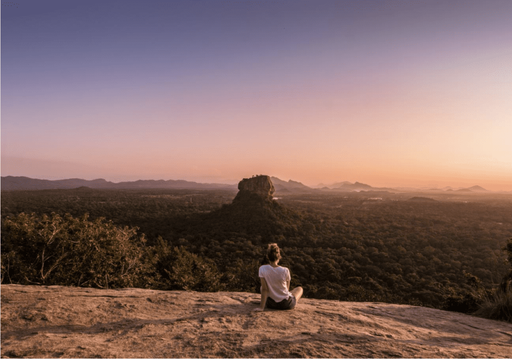 Across Ceylon - Cycling in Sri Lanka - Person looking at Sigiriya from Pidurangala